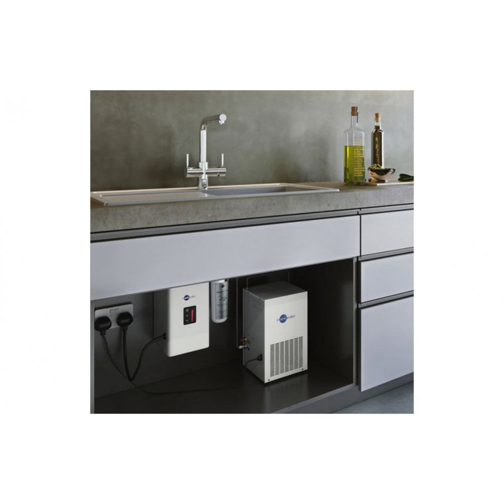 InSinkErator NeoChiller Cold Water Chiller Tank installed in a kitchen.