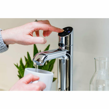 Zip HydroTap Classic Plus G5 (Bright Chrome)- lifestyle image zooming in on woman's hand pressing the Boiling water button, alongside Chilled, Sparkling buttons on control pad
